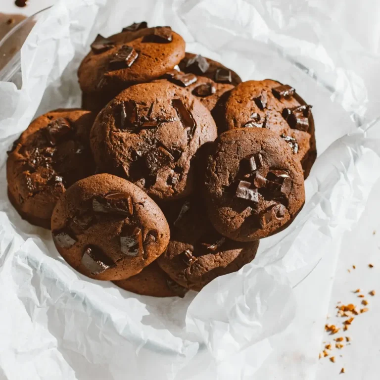 A plate of double chocolate cookies, rich and chewy with gooey chocolate chunks, perfect for chocolate lovers.