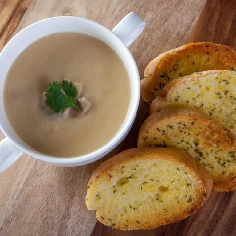 A freshly baked loaf of garlic bread, golden and crispy with a fragrant garlic butter topping.