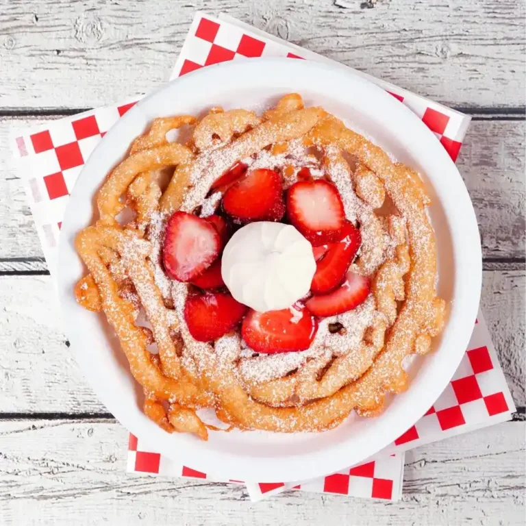 A freshly made funnel cake, golden brown and topped with powdered sugar, perfect for fairs and festivals.