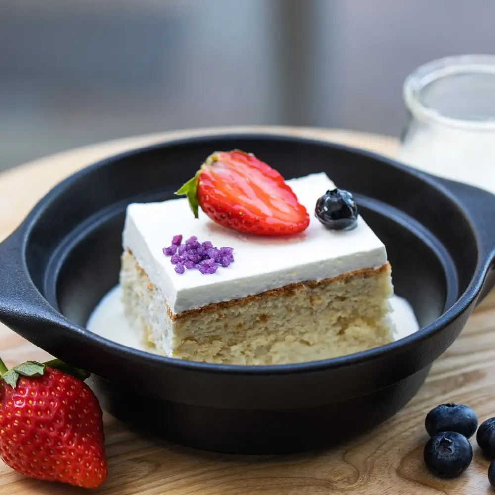 A slice of kefir sheet cake, light and fluffy with a smooth frosting and a soft, moist texture.